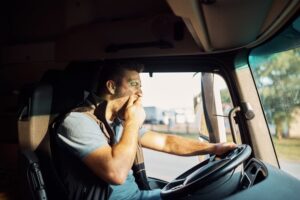 Portrait of a tired truck driver feeling drowsy.






