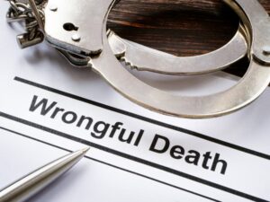 Documents about wrongful death and metal handcuffs.