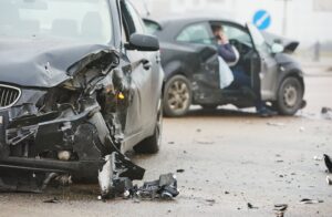 car crash accident on street, damaged automobiles after collision in city